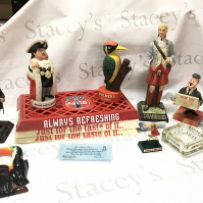 Pub advertising figures including Worthingtons behind every great man Beswick porcelain figure, a Youngers Tartan beer, Bulmers cider, Drambuie, porcelain Guinness toucan wall plaque by Carltonware. ( damaged) , Coca Cola tray etc . Also including a box of other merchandise including a Players cigarettes dish, Britivic dish etc .This lot cannot be posted