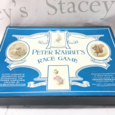 A boxed vintage Peter rabbits race game , postage category C