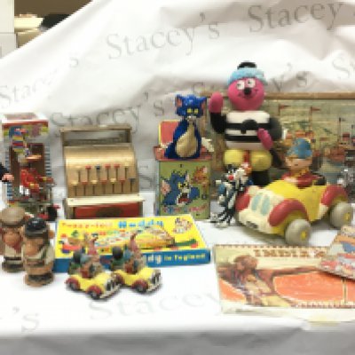 A collection of vintage toys including a Mattel Tom and Jerry music box , Diana Jones Bassetts man, Corgi noddys car, tin plate duck on bike. Postage category C x 2