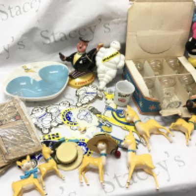 A collection of advertising items including a Bassetts man soft toy figure, Beswick Double Diamond porcelain figure, Michelin man figure, collection of Michelin stickers , Baby Cham items ,Michelin maps. This lot cannot be posted