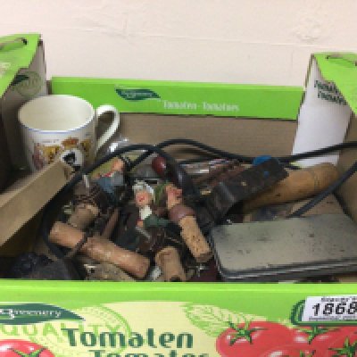 A box containing Vintage carved wood and painted Continental cork bottle tops cork screws and other oddments.