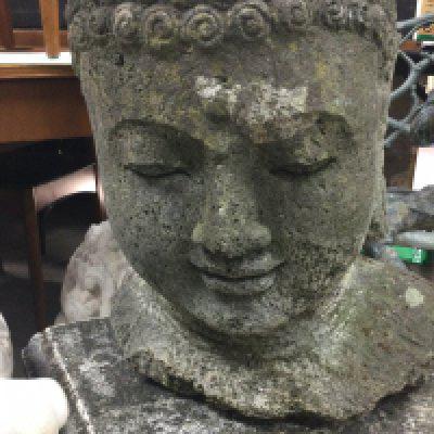 A Carved Buddha/ deity head in basalt. 45 cm .