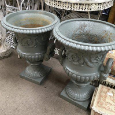 A pair of cast iron classical style garden urns. 60 cm .