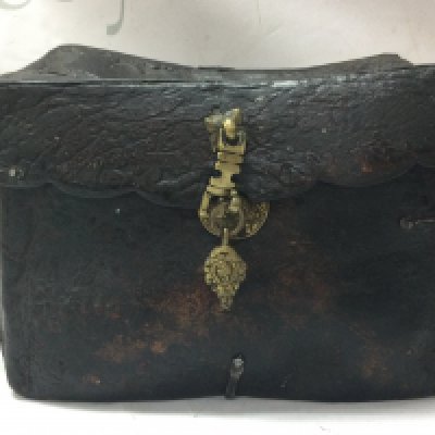 A Tibetan Yak Skin and iron bound saddle box 16cm tall 21cm wide 13cm long approx . Postage category C
