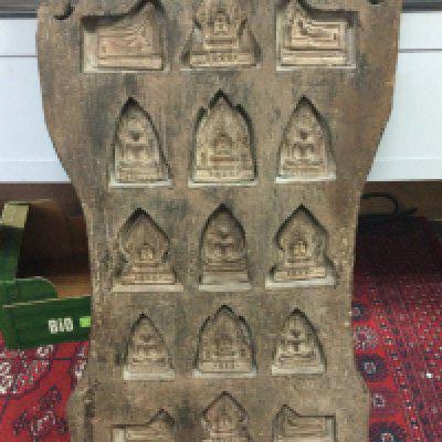 A large Tibetan wooden shrine with inset reliefs. 41cm wide 80cm tall.