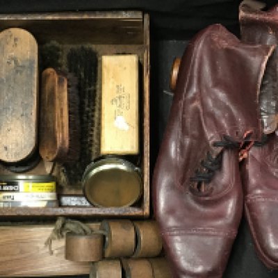 A pair of vintage leather roller skates . postage cat C