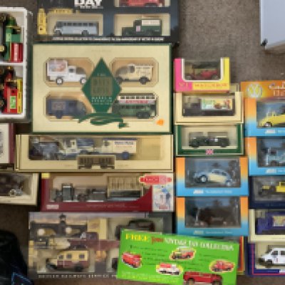 A collection of boxed Diecast toy cars.