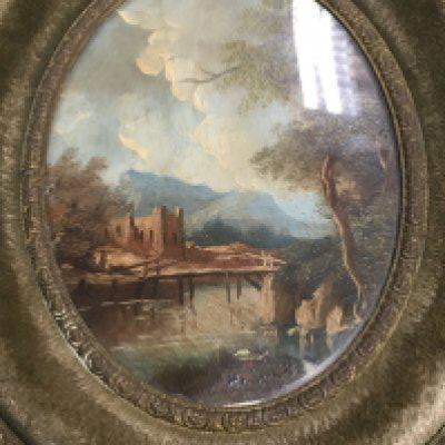 A framed pair of oval Continental oil painting land scape view .