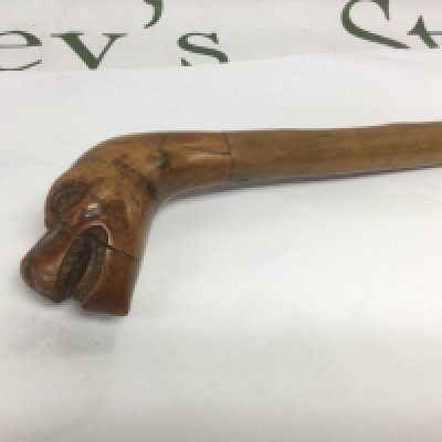 A walking cane, the handle in the form of the head of a mythical beast, approx total length 90cm. Shipping category D.