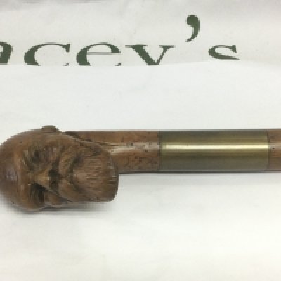 A walking cane, the handle carved in the form of the head of a bearded gentleman, approx total length 85cm. Shipping category D.