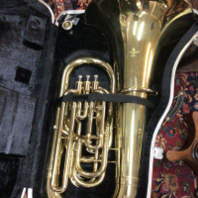 A quality lacquered brass Tuba in a fitted case maker Besson London 700. Condition few scratches and one small dent.