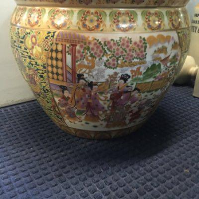 A large Japanese style fish bowl decorated with figures