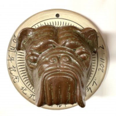A Japanese studio pottery English Bulldog wall plaque, signed and dated. 23cm diameter.