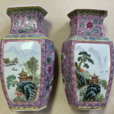 A pair of 20th Century Cantonese porcelain vases with landscape scenes. 20cm.