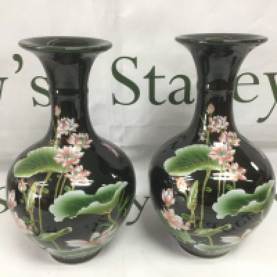 A pair of 20th Century export porcelain Chinese vases with floral decoration on a black ground, approx height 23.5cm. Shipping category D.