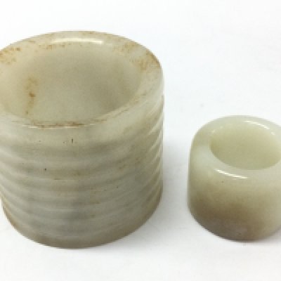 Two jade rings 6 and 3cm wide. 3 & 5Cm tall. Postage category B