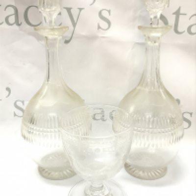 a Victorian masonic wheel etched goblet and a pair of decanters , chip on rim of goblet . This lot cannot be posted- NO RESERVE