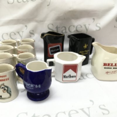A collection of ceramic bar advertising jugs including Guinness , Marlboro, Stock 84 brandy, Bells Scotch, John Player . This lot cannot be posted