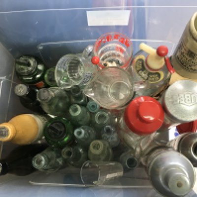 A collection of vintage glass bottles and cups. This lot cannot be posted