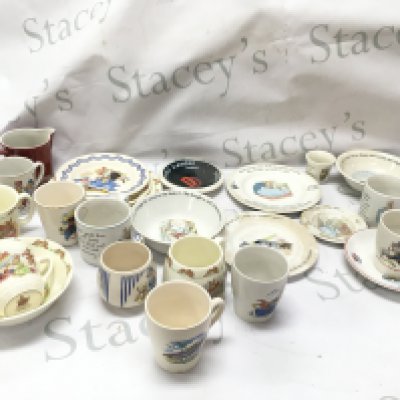 A collection of vintage children's ceramic cups and saucers including The Lone ranger KSP England , Andy Pandy Royal Norfolk , Peter rabbit and Beatrix potter Wedgwood, Huckleberry Hound Ridgwood pottery,