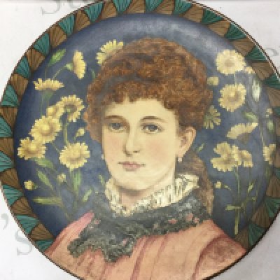 A Doulton burslem 19th century charger signed A. Harvey with floral and maiden portrait design , featured in the Howell & James Art Pottery Exhibition of 1883. 42Cm wide. This lot cannot be posted