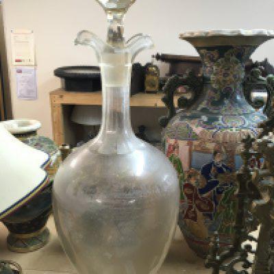 A apothecary decanter with detachable stomper .