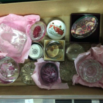 A collection of paperweights, including Scottish medina and past time examples.