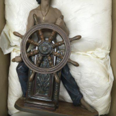 A very large boxed Lladro figure of a sailor at the ships wheel. No obvious damage or restoration, base included. 55cm in height approximately.