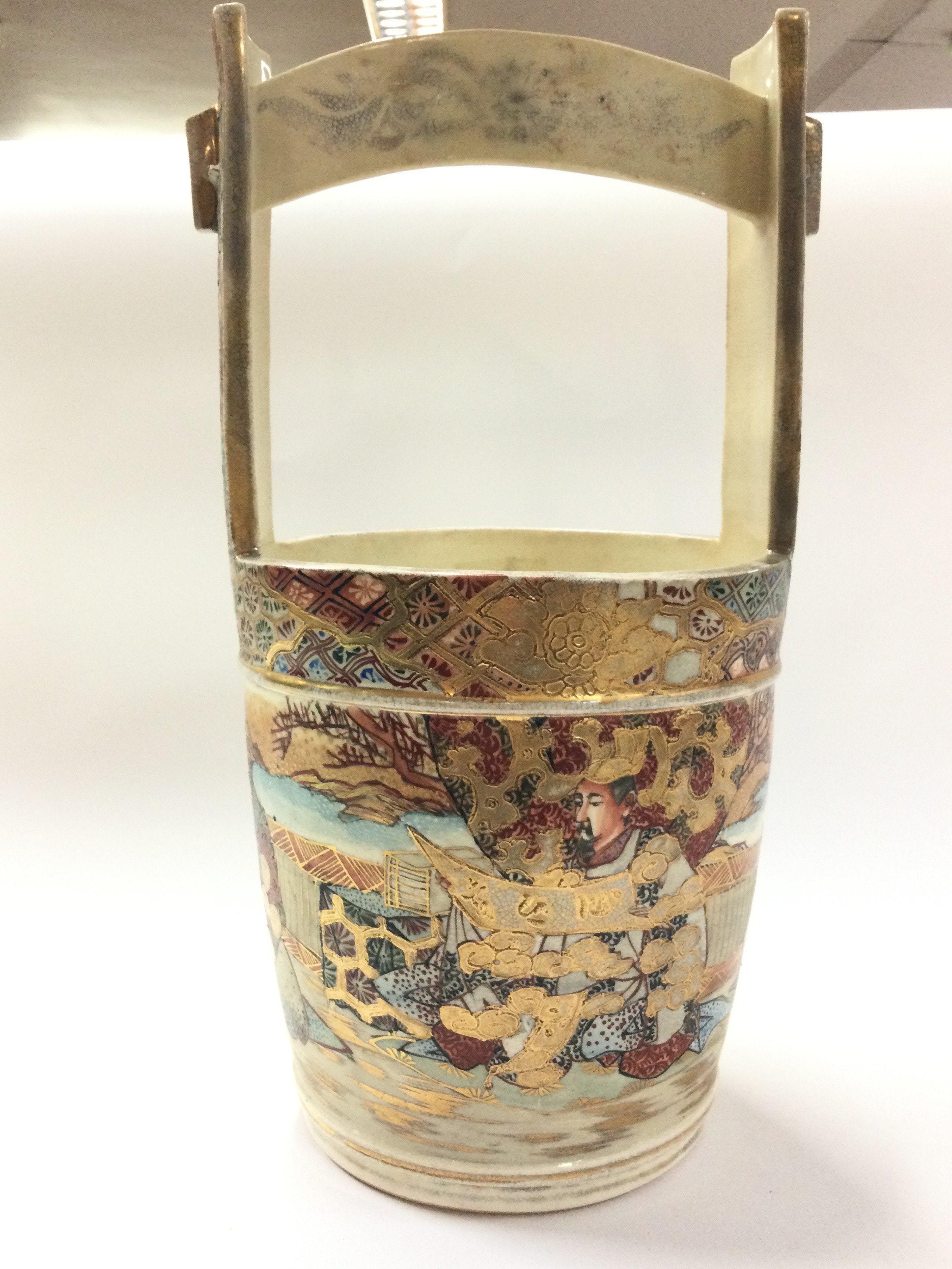 A Japanese satsuma bucket vase, decorated with figures. 31.5cm tall approximately. Postage category D- NO RESERVE