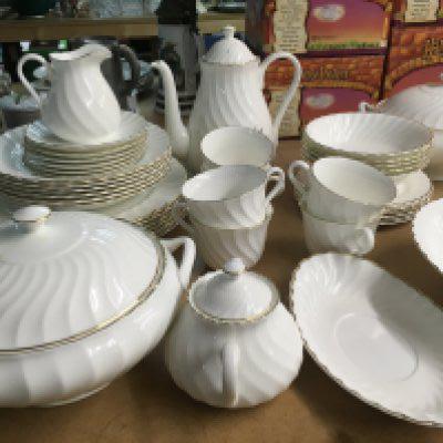 A Wedgwood gold Chelsea service including coffe pot cups saucers and serving dishes.