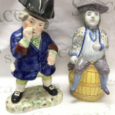 Porcelain Staffordshire Toby figure and a French faience "Jacquot" jug, 33cm tall. This lot cannot be posted