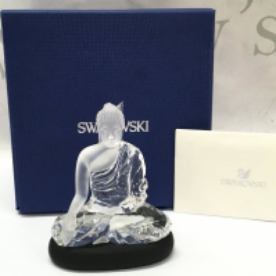 A boxed Swarovski Buddha with stand , 9.5cm tall. Postage category B
