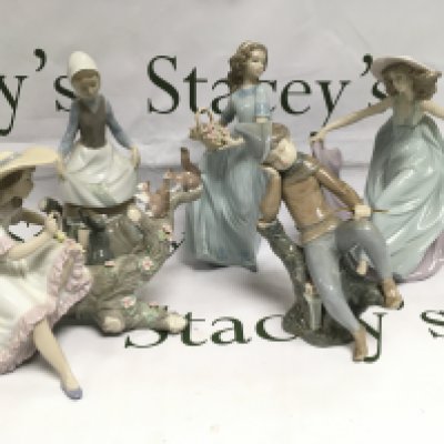 Four Lladro and one other similar figure, most with boxes. Shipping category D.