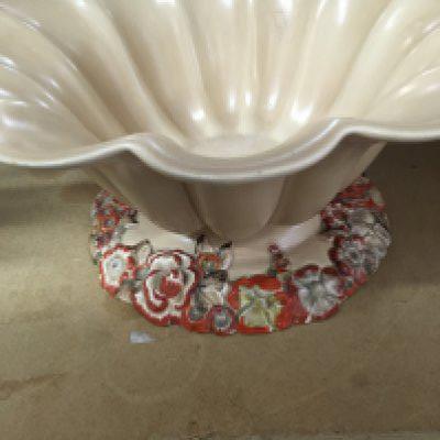 A Clarice Cliff bowl of floral design the base with raised flower heads .