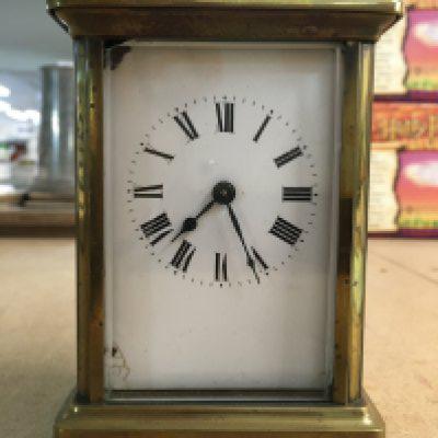 A brass case carriage clock, the enamel dial with Roman numerals- NO RESERVE