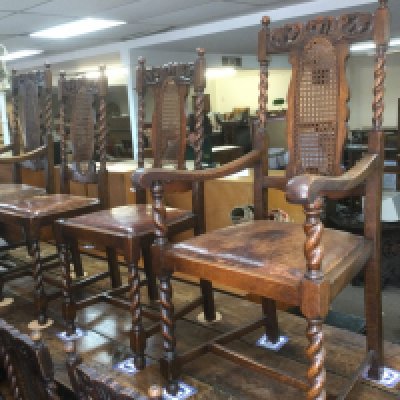 Six oak dining chairs and two carvers with carved top rails and barley twist supports. Shipping category D.- NO RESERVE