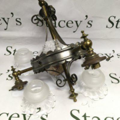 A three branch steel and brass ceiling lamp, approx height 44cm. Damage to one shade. Shipping category D.