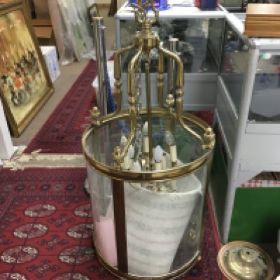 A large curved glass light fitting