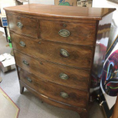 A mahogany bow fronted chest of drawers fitted two short drawers over three long, approx 107cm x 52.5cm x 119cm. Shipping category D.