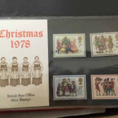 A box containing some presentation packs first day covers vintage playing cards and other ephemera.- NO RESERVE