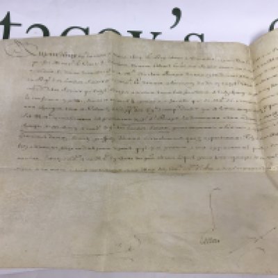 A handwritten document on vellum signed by King Louis XIV of France. Shipping category A.