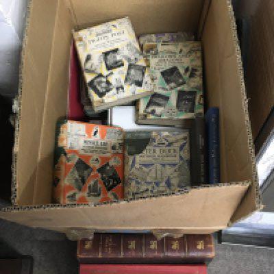 A box of books including examples by Arthur Ransome. Shipping category D.