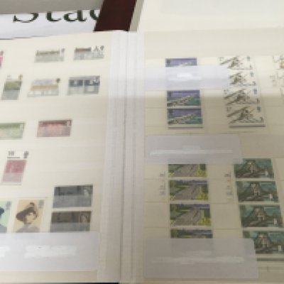 An album containing unused Australian pictorial stamps and an album containing British and commonwealth stamps from 1952 Onwards all Elizabeth II unused many blocks of stamps and most pictorial.