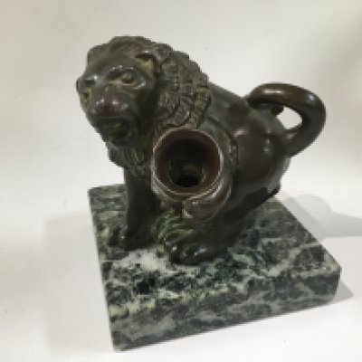 A Victorian style bronze lion figure pen holder.