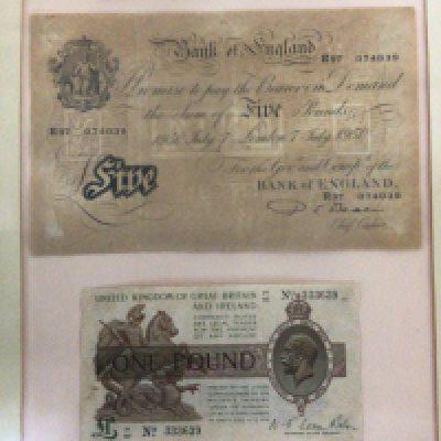 A collection of framed bank notes including sealed frames including a 1950 five pound note date 7/7/1950 and other Elizabeth II bank notes and a Chinese Government bond framed. (5)