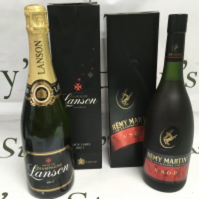Two bottles of champagne comprising a black label Landon brut and a Remy Martin champagne cognac. Shipping category D.