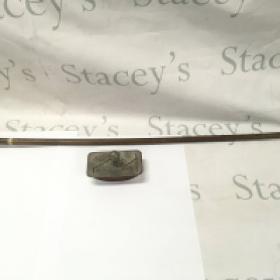 An antique golf Sunday stick and golf themed paper weight