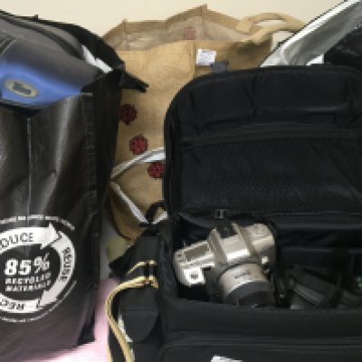 A Collection of cameras including Nikon Minolta Canon with extra lenses camera bags video cameras and more