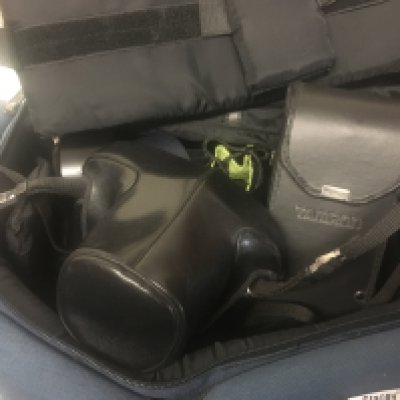 A Pentax ME Super camera with accessories fitted in a blue holder.