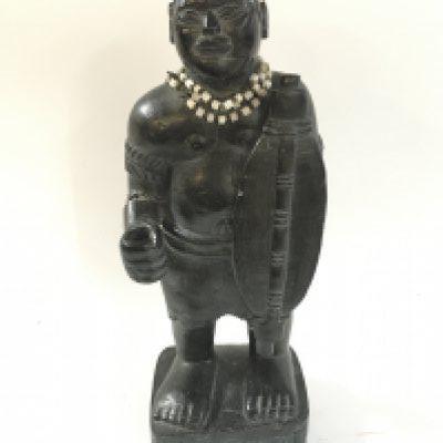 A carved stone African tribal hunter figure , 32cm tall.